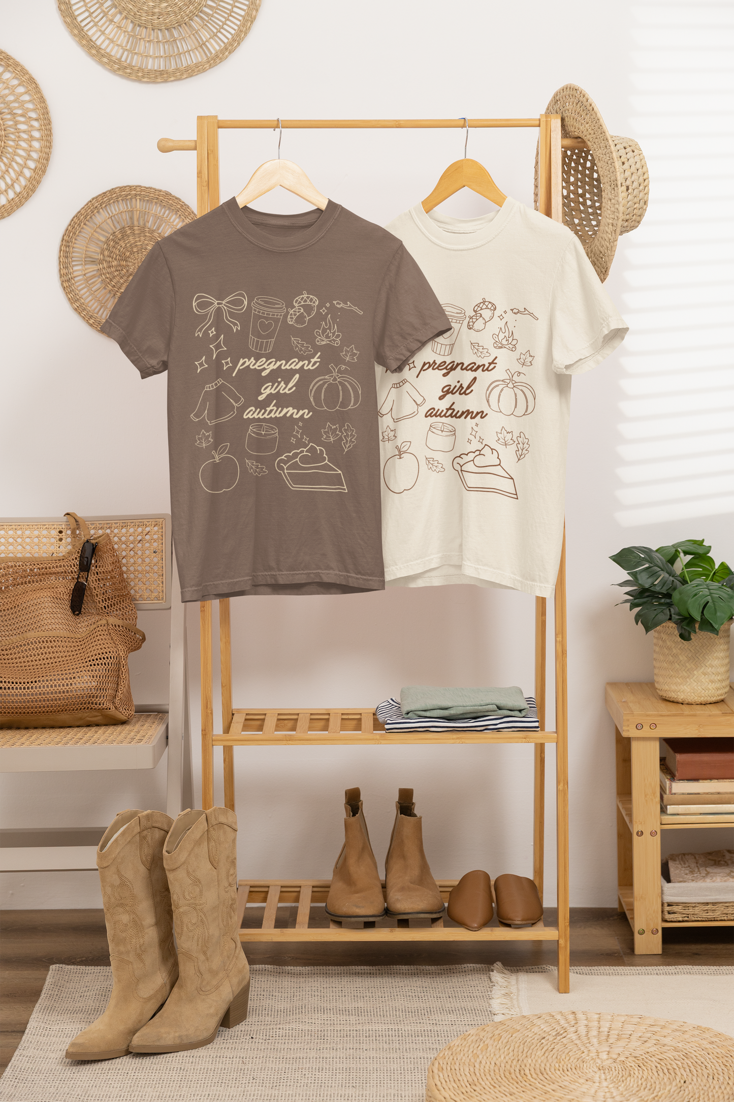 Two t-shirts on a rack with boots and decor items in a room.